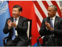 epa05521727 US President Barack Obama (R) and Chinese President Xi Jinping clap as UN Secretary General Ban Ki-moon  (not pictured) delivers his speech during a joint ratification of the Paris climate change agreement ahead of the G20 Summit at the West lake State Guest House in Hangzhou, China, 03 September 2016. The G20 Summit will be held in Hangzhou on 04 to 05 September.  EPA/HOW HWEE YOUNG